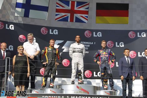 Lewis Hamilton on the podium with Kimi Raikkonen and Sebastian Vettel at the Hungaroring in 2013