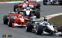 Schumacher passes Hakkinen to win rain-hit home race and extend points lead